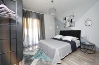 Postel nebo postele na pokoji v ubytování Apartmani Marta