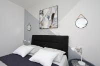 Postel nebo postele na pokoji v ubytování Apartmani Marta