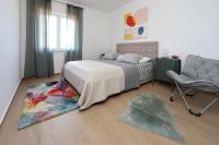 Postel nebo postele na pokoji v ubytování Apartmani Marta