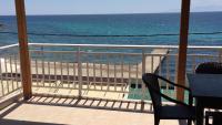 a balcony with a view of the beach at Emy Studios in Fanari