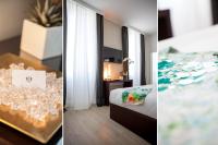 Łóżko lub łóżka w pokoju w obiekcie Sanremo Luxury Suites