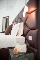 Łóżko lub łóżka w pokoju w obiekcie Sanremo Luxury Suites