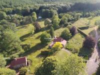 an aerial view of a house in a field at Ancienne Auberge des Brizards - Morvan (14 personnes) in Quarré-les-Tombes