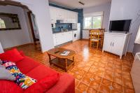 Una televisión o centro de entretenimiento en Apartamentos Cudillero