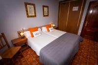 Cama o camas de una habitación en Apartamentos Cudillero