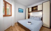 Postel nebo postele na pokoji v ubytování Apartments Drenje 294