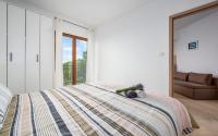 Postel nebo postele na pokoji v ubytování Apartments Drenje 294