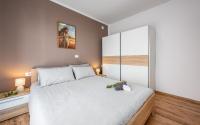 Postel nebo postele na pokoji v ubytování Apartments Drenje 294