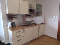 Kuchnia lub aneks kuchenny w obiekcie Apartament BOOKS & SUN by the Sea