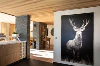 a painting of a deer on a wall in a kitchen at Grandes Rousses Hotel &amp; Spa in L&#39;Alpe-d&#39;Huez