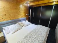 A bed or beds in a room at Grand Spa Holiday Home