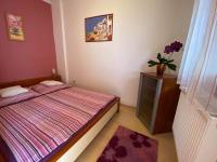 Posteľ alebo postele v izbe v ubytovaní Hellasz Apartman