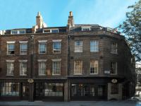 a large brick building on a city street at The Rookery in London