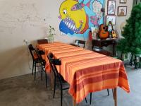 a dining room with a table with an orange table cloth at Taroko Susi Space in Xincheng