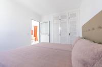 A bed or beds in a room at Apartamentos Corona Mar
