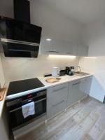 Kuchyň nebo kuchyňský kout v ubytování Apartament Drewno i Morze