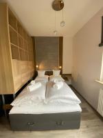 Postel nebo postele na pokoji v ubytování Apartament Drewno i Morze