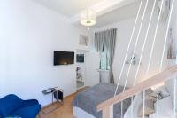 Televízia a/alebo spoločenská miestnosť v ubytovaní Apartments Caleta