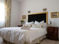A bed or beds in a room at Casa Villamena