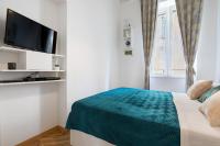 Televízia a/alebo spoločenská miestnosť v ubytovaní Apartments Caleta