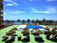 Bazén v ubytování Costa Paradise - BEACHFRONT APARTMENT nebo v jeho okolí