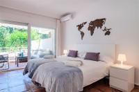 Postel nebo postele na pokoji v ubytování Jardines del Mar Apartments