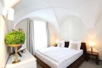 Postel nebo postele na pokoji v ubytování Stylische Cityapartments Benedikt
