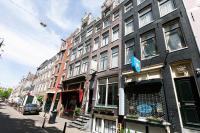 a large building on a city street at Quentin Golden Bear Hotel in Amsterdam