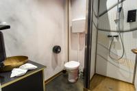 a bathroom with a toilet and a sink at Timeout Heritage Hotel Zagreb in Zagreb