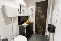 a small bathroom with a toilet and a sink at Timeout Heritage Hotel Zagreb in Zagreb