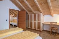 A bed or beds in a room at Apartment Kronplatz