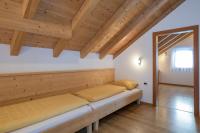 A bed or beds in a room at Apartment Kronplatz