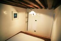 Posteľ alebo postele v izbe v ubytovaní Bellissimo appartamento in Palazzo Storico