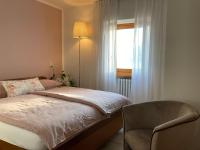 A bed or beds in a room at Casa Oliva Castelletto di Brenzone