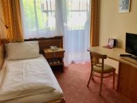 Televízia a/alebo spoločenská miestnosť v ubytovaní Landhotel Moorhof