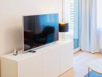 Televízia a/alebo spoločenská miestnosť v ubytovaní Apart111 Apartamenty - Garden