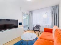 Televízia a/alebo spoločenská miestnosť v ubytovaní Apart111 Apartamenty - Garden