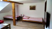 Postel nebo postele na pokoji v ubytování Apartmány Kukaččí hnízdo