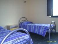 Posteľ alebo postele v izbe v ubytovaní casa con terrazza fronte mare
