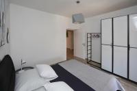 Postel nebo postele na pokoji v ubytování Apartmani Marta