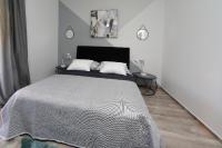 Postel nebo postele na pokoji v ubytování Apartmani Marta