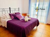 Postel nebo postele na pokoji v ubytování Villa Pelae