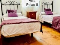 Postel nebo postele na pokoji v ubytování Villa Pelae