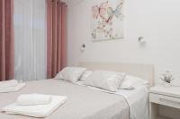 Posteľ alebo postele v izbe v ubytovaní Apartments PETRUSIC