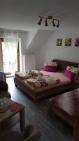 A bed or beds in a room at Penzión Zunama