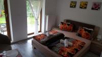 A bed or beds in a room at Penzión Zunama