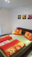 A bed or beds in a room at Penzión Zunama