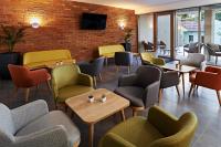 Posezení v ubytování Hotel Adalbert Szent Tamás ház