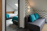 Postel nebo postele na pokoji v ubytování Hotel Adalbert Szent Tamás ház