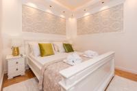 Posteľ alebo postele v izbe v ubytovaní Apartmani Julija